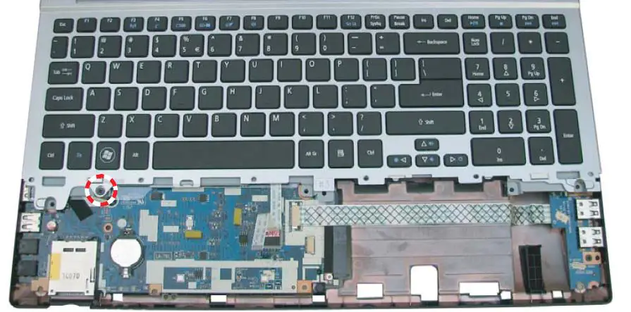 Remove the screws securing the palm rest