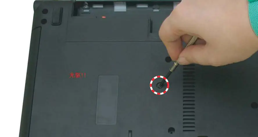 Remove the screw securing the optical drive.