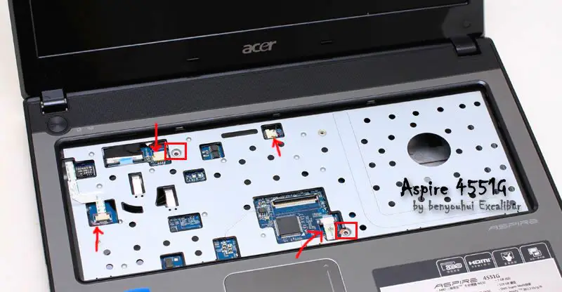 Disconnect four cables from the palm rest