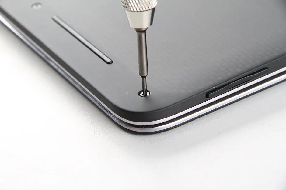 Remove the screws securing the bottom cover