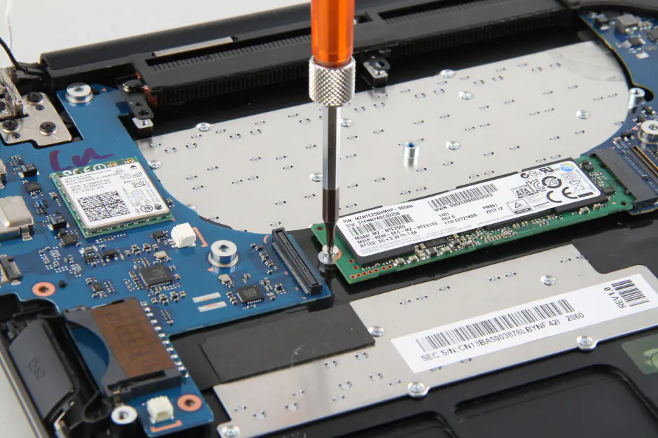Remove the screw securing the SSD