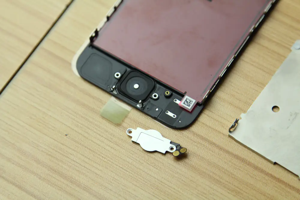 Install the home button on the new screen assembly