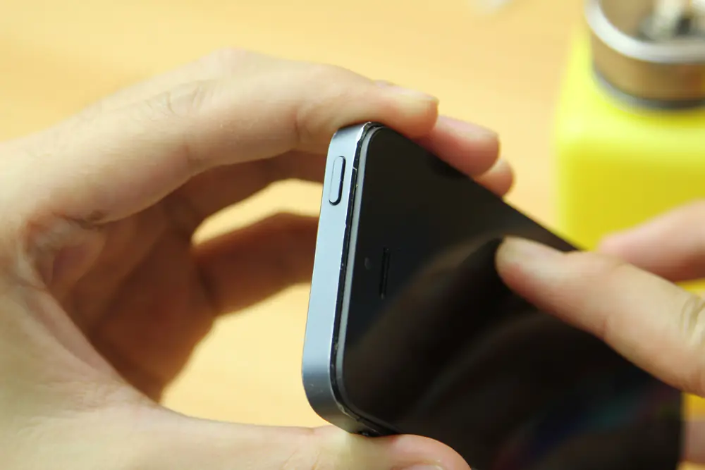 Install the new screen assembly on the iPhone 5s