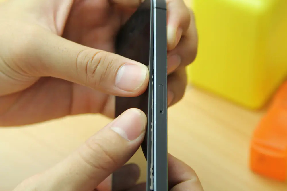 Install the new screen assembly on the iPhone 5s