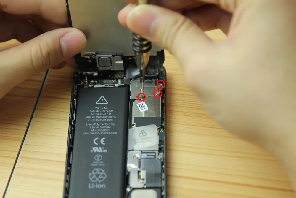 Remove the three screws securing the screen assembly cable bracket