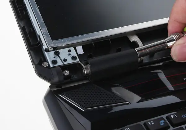 Push the screwdriver into the plastic case