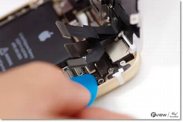 Disconnect the four ribbon cables.