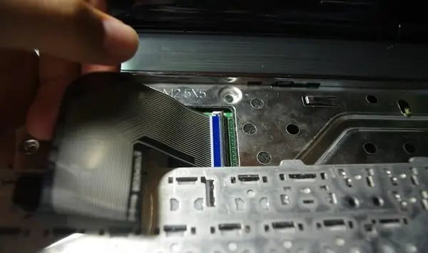 Pull out the keyboard cable