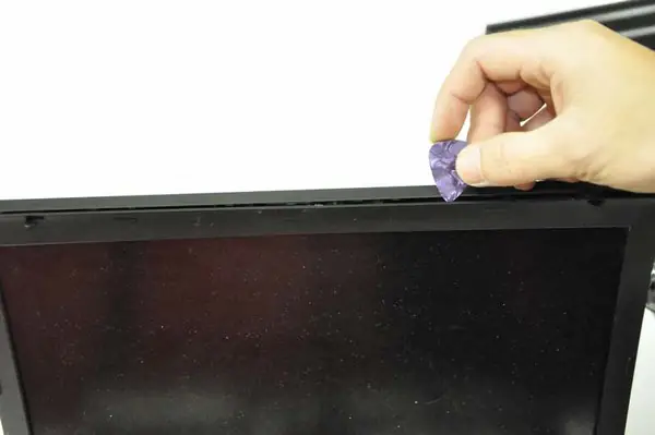 Pry up the screen bezel