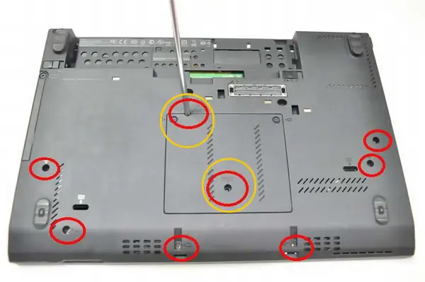 Remove the two (yellow) screws from the bottom case
