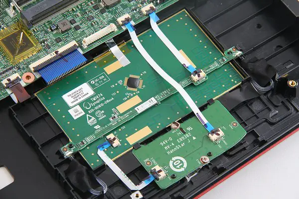 Disconnect the keyboard cable and touchpad cable