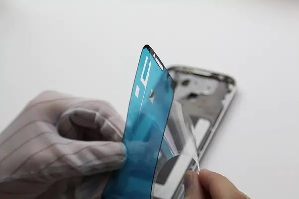Install the new double-sided adhesive film