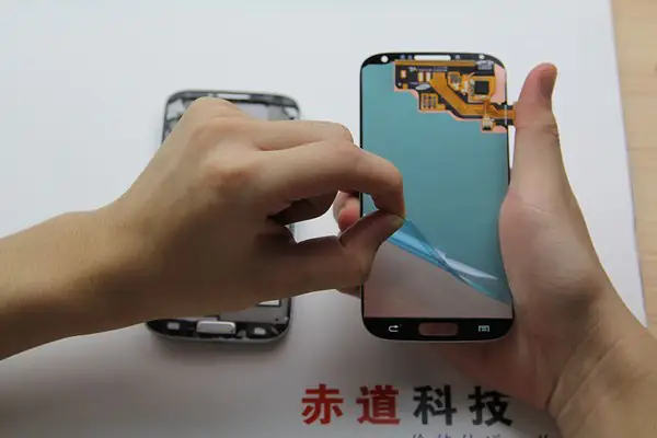 Remove the protective film from the new display