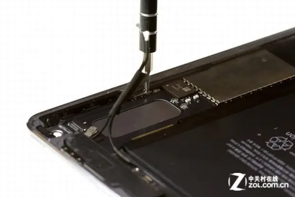 Remove the screws securing the volume button