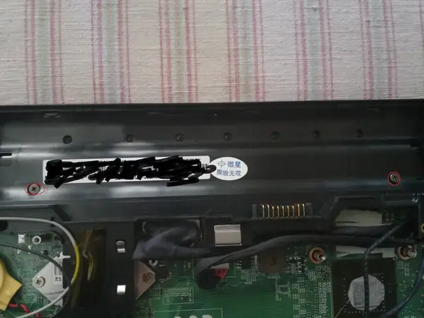 Remove the two screws in the battery bay