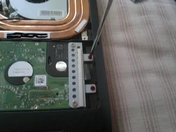 Remove the two screws securing the hard drive