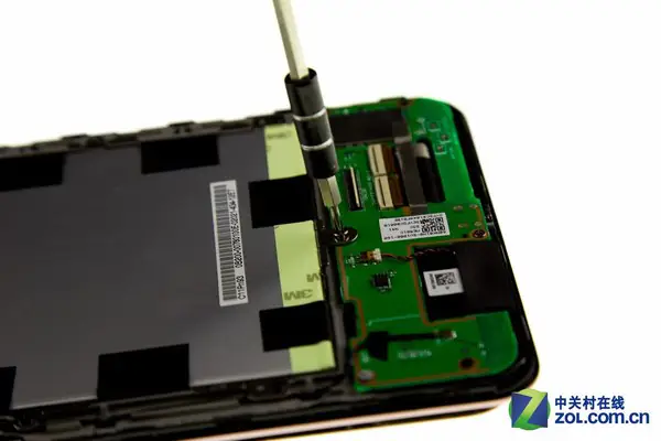 Remove the nine screws securing the battery