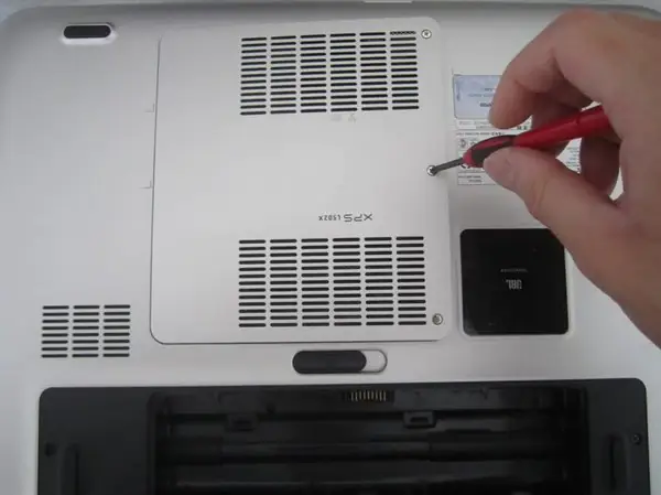 Remove the memory and wireless card cover