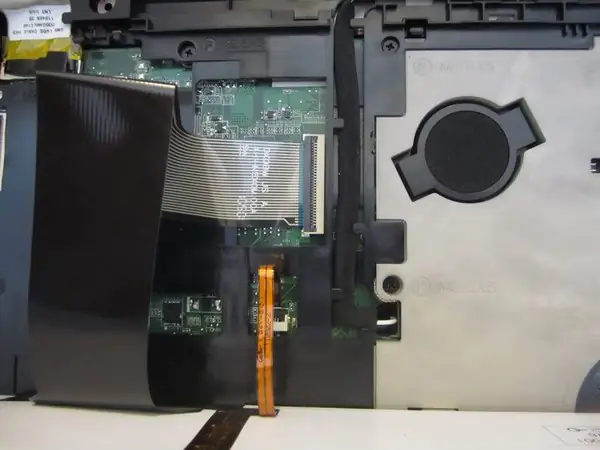 Disconnect the keyboard cable and backlit cable