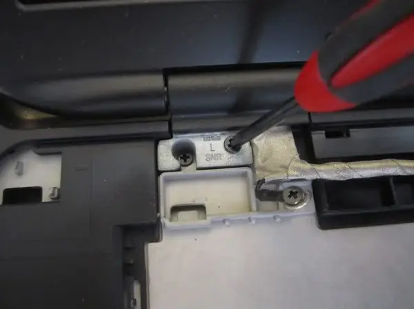 Remove the four screws securing the LCD hinges
