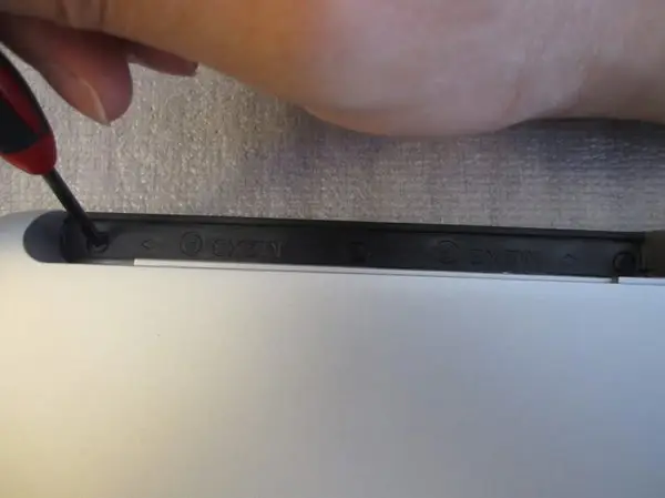 Remove the three screws in the DVD drive bay.