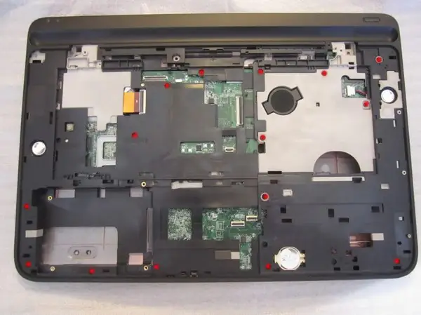 Remove all screws securing the middle frame