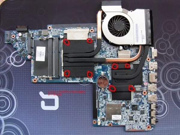 Remove the eight screws securing the heat sink