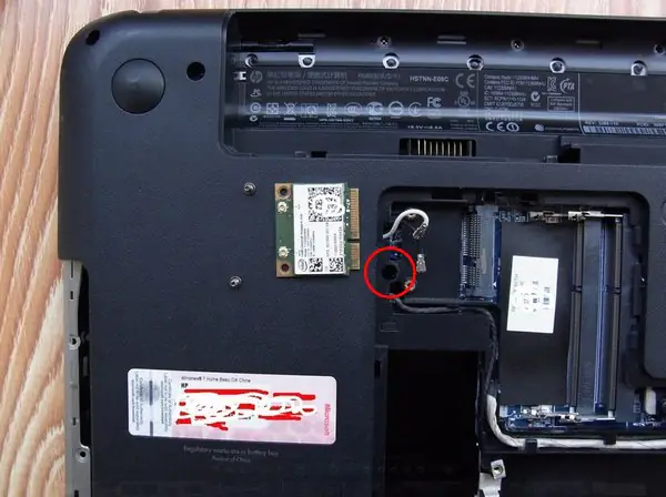 Remove the screw securing the keyboard