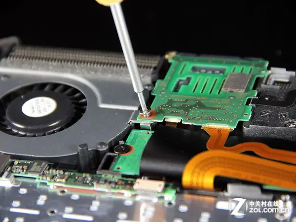 Remove the screws securing the card reader