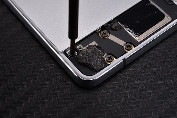 Remove all screws securing the back cover
