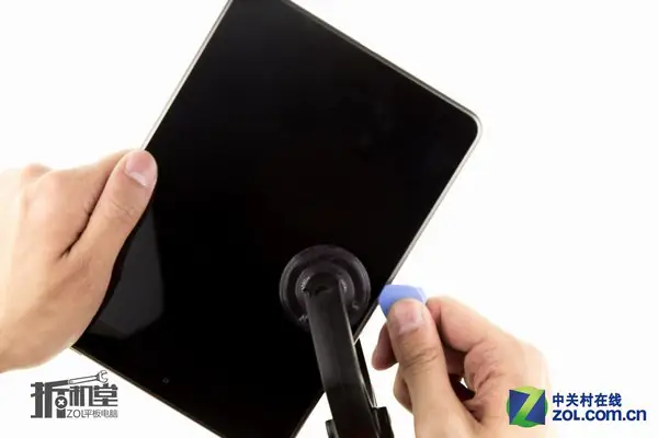 Insert a pick or pry tool into the gap
