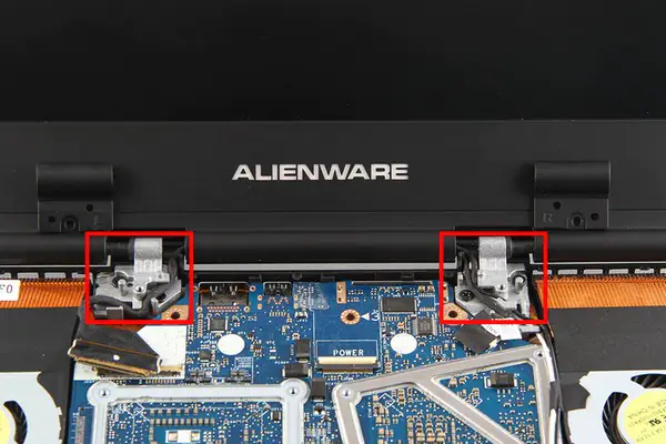 Remove the screws securing the LCD hinges
