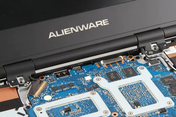 Remove the four screws securing the LCD hinge