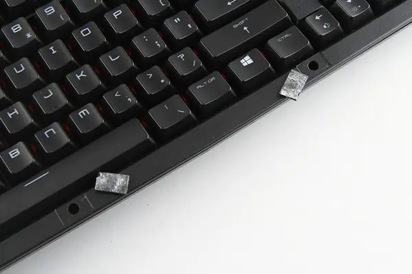 Remove the screws under the rubber mat