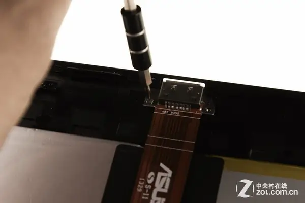 Remove two screws securing the cable