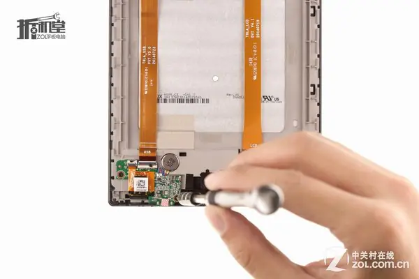 Remove the two screws securing the small circuit board