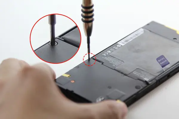 Remove the eleven screws securing the middle frame