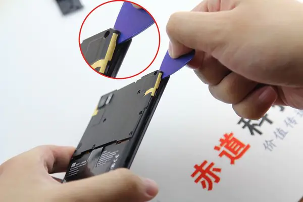Pry up the motherboard cover