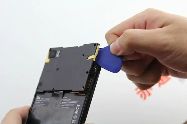 Pry up the motherboard cover