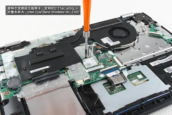 Remove the screw securing the wireless card
