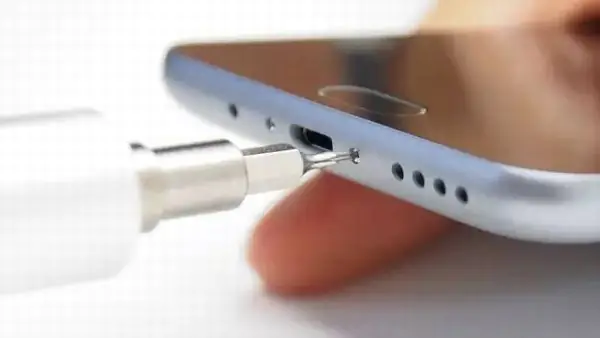 Remove the two screws next to the micro-USB port