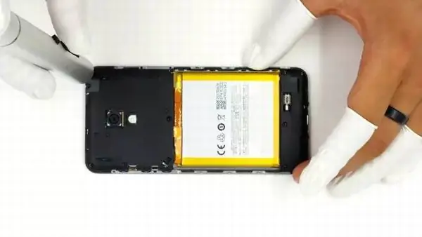 Remove all screws securing the middle frame and speaker module