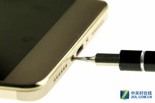 Remove the two screws next to the Micro-USB port