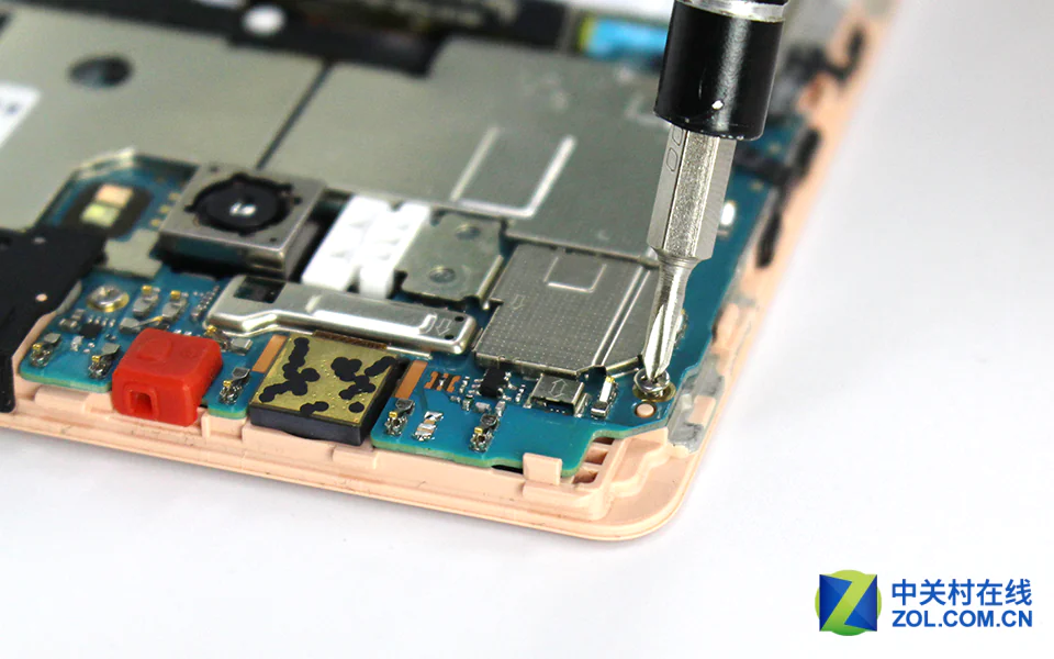 Remove all screws securing the motherboard and speaker module
