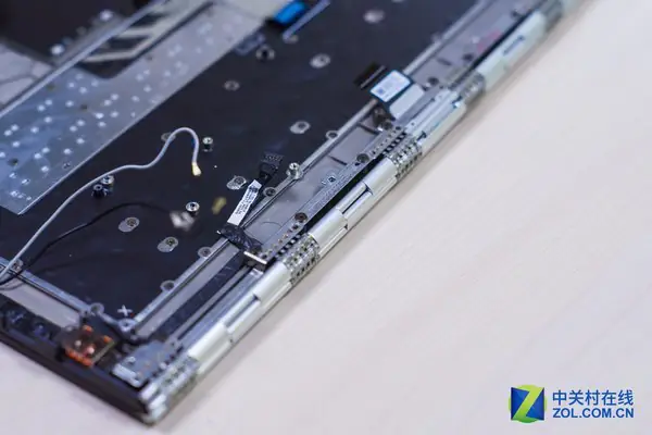 Remove all screws securing the LCD hinges