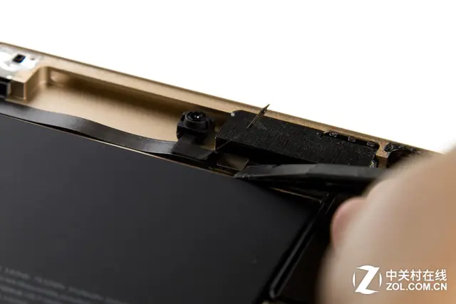 Disconnect the rear camera cable, front camera cable, and headphone cable