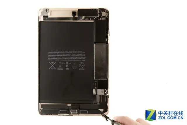 Remove the four screws securing the speaker module