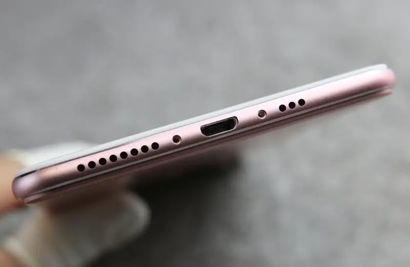 Remove the two screws next to the Micro USB port