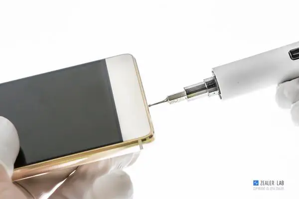 Remove the two screws beside the USB Type-C port