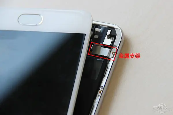 Remove the two screws securing the metal bracket